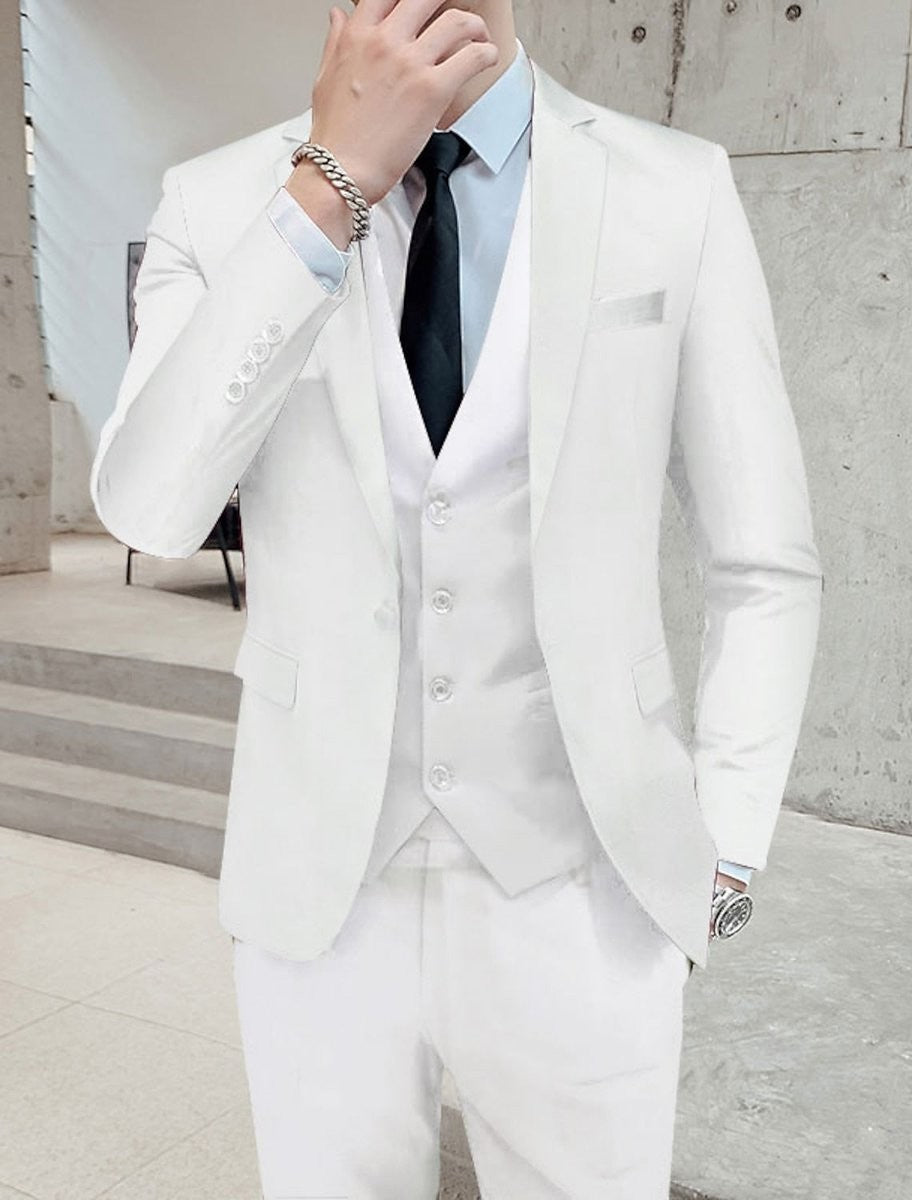 White three-piece suit with tailored blazer and slim trousers