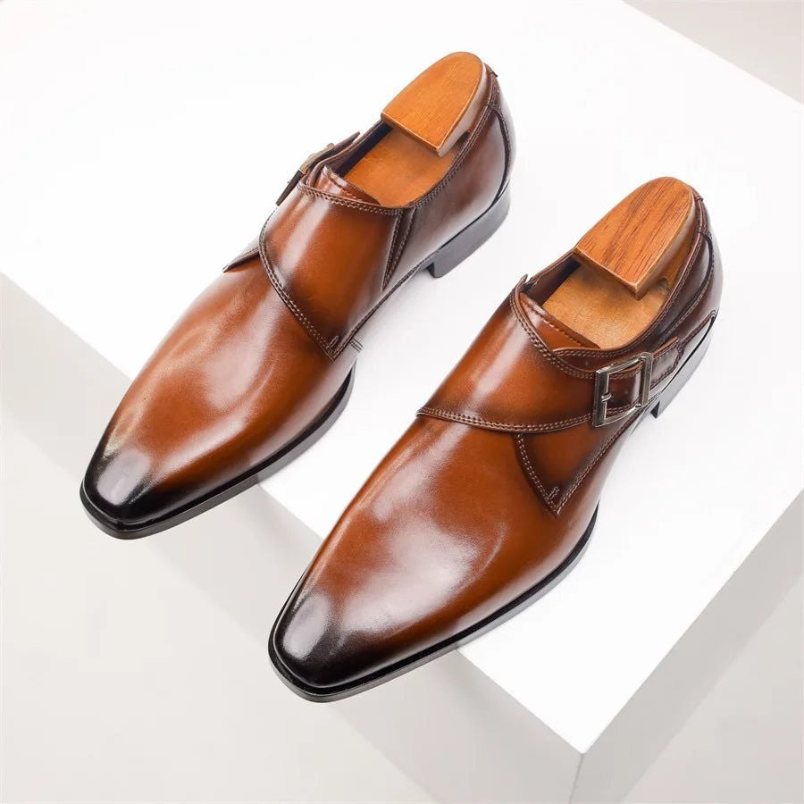 Overhead view of tan single monk strap shoes with silver buckle detail