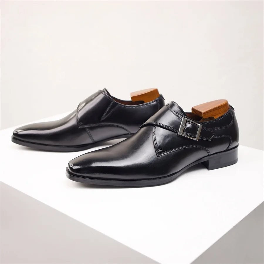 Black leather single monk strap dress shoes with polished finish
