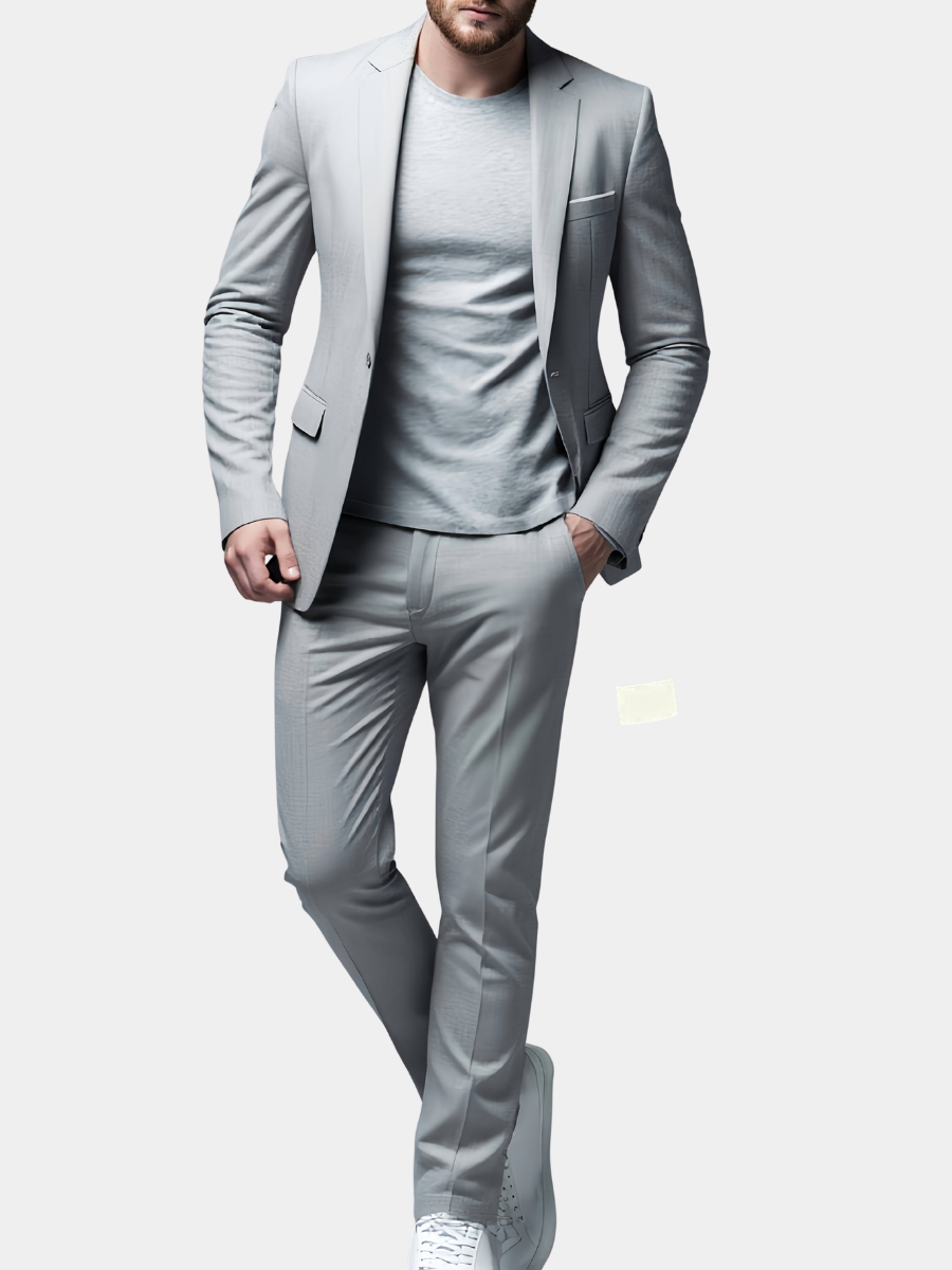 Light grey skinny suit worn with a plain T-shirt and white trainers