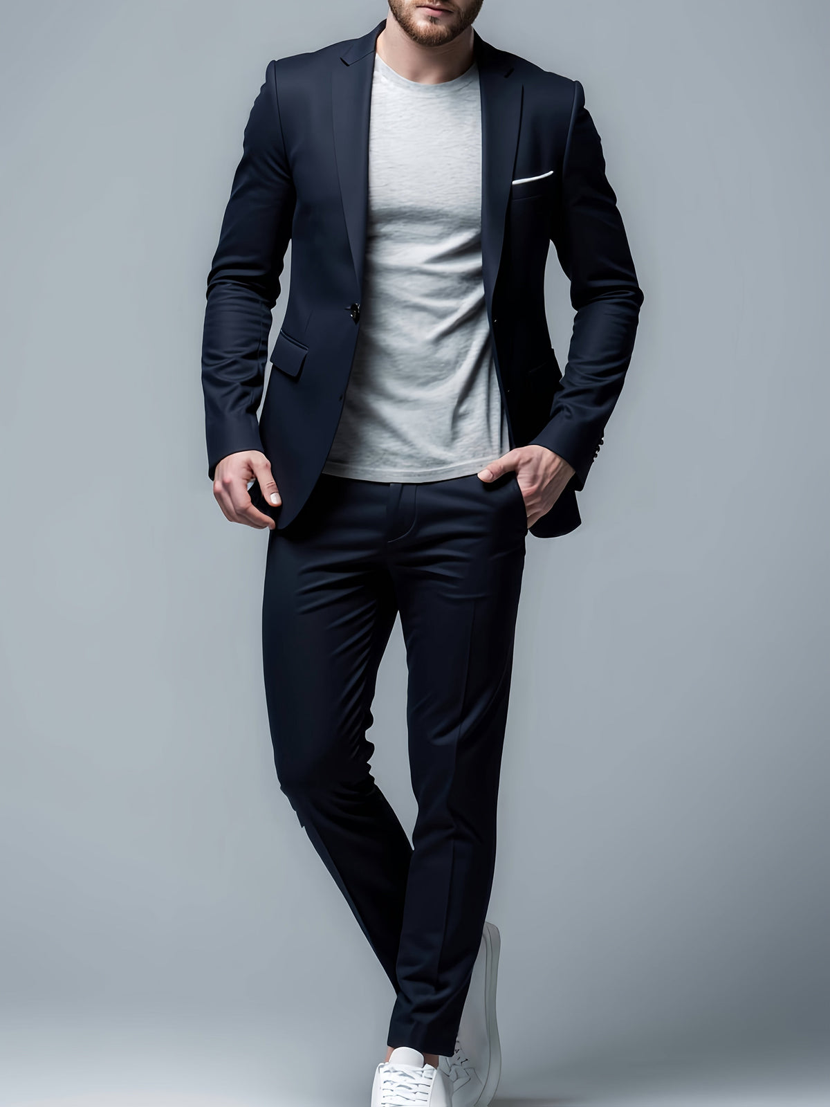 Close-up of navy slim-fit blazer and trousers styled with white sneakers