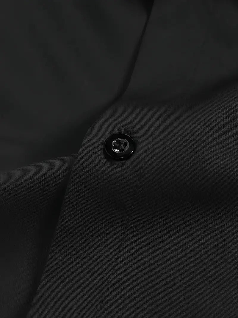 Close-up of black button on breathable shirt fabric