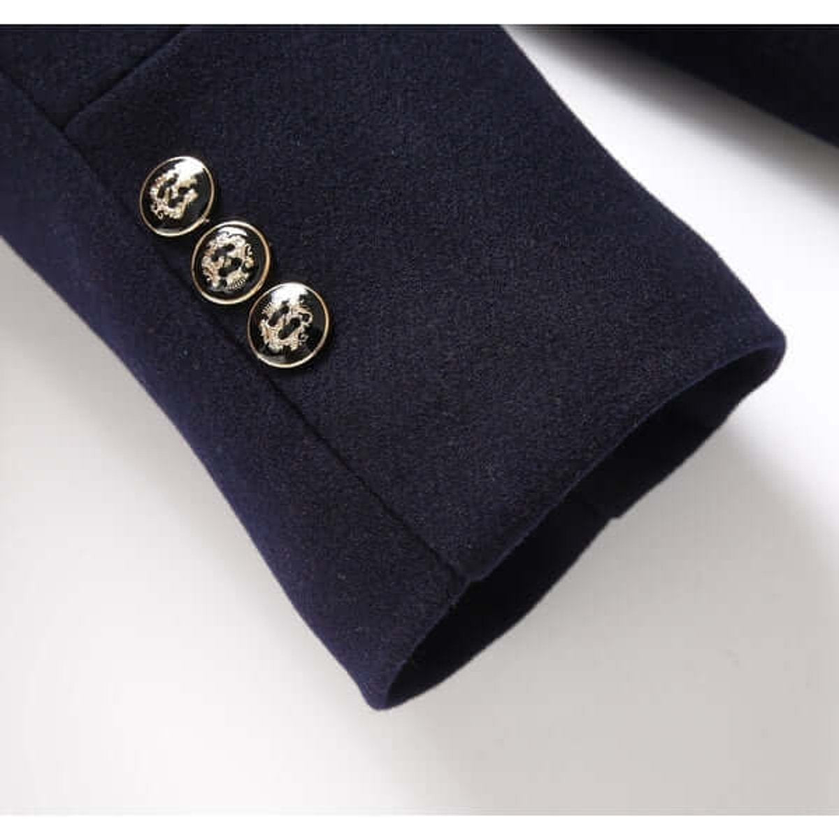 Close-up of triple dragon buttons on navy overcoat cuff