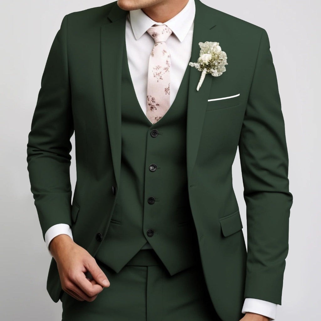 Dark green three-piece suit paired with pale pink floral tie