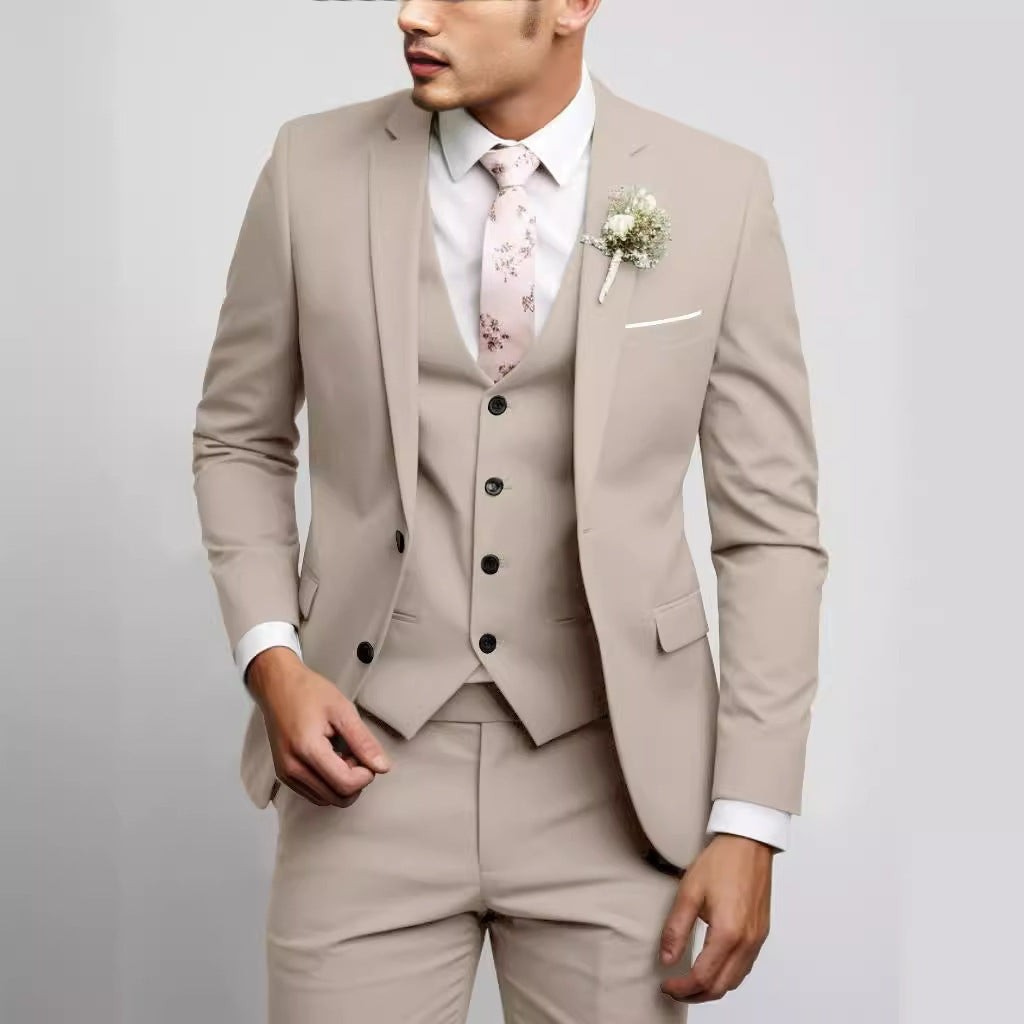 Beige three-piece suit with waistcoat, worn with blush floral tie