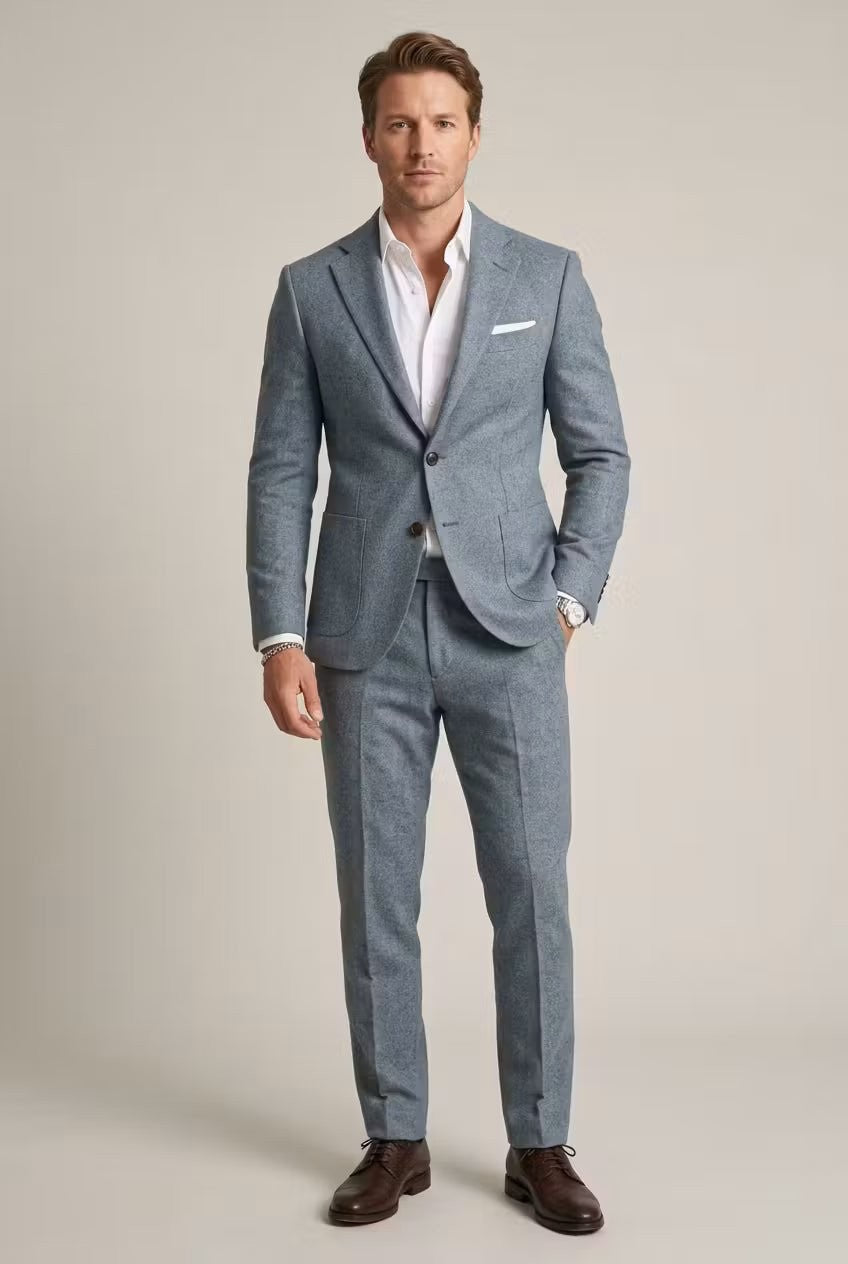 Man wearing pale blue textured two-piece slim-fit suit with white shirt