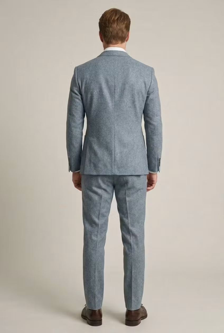 Rear view of pale blue tailored suit jacket and matching trousers