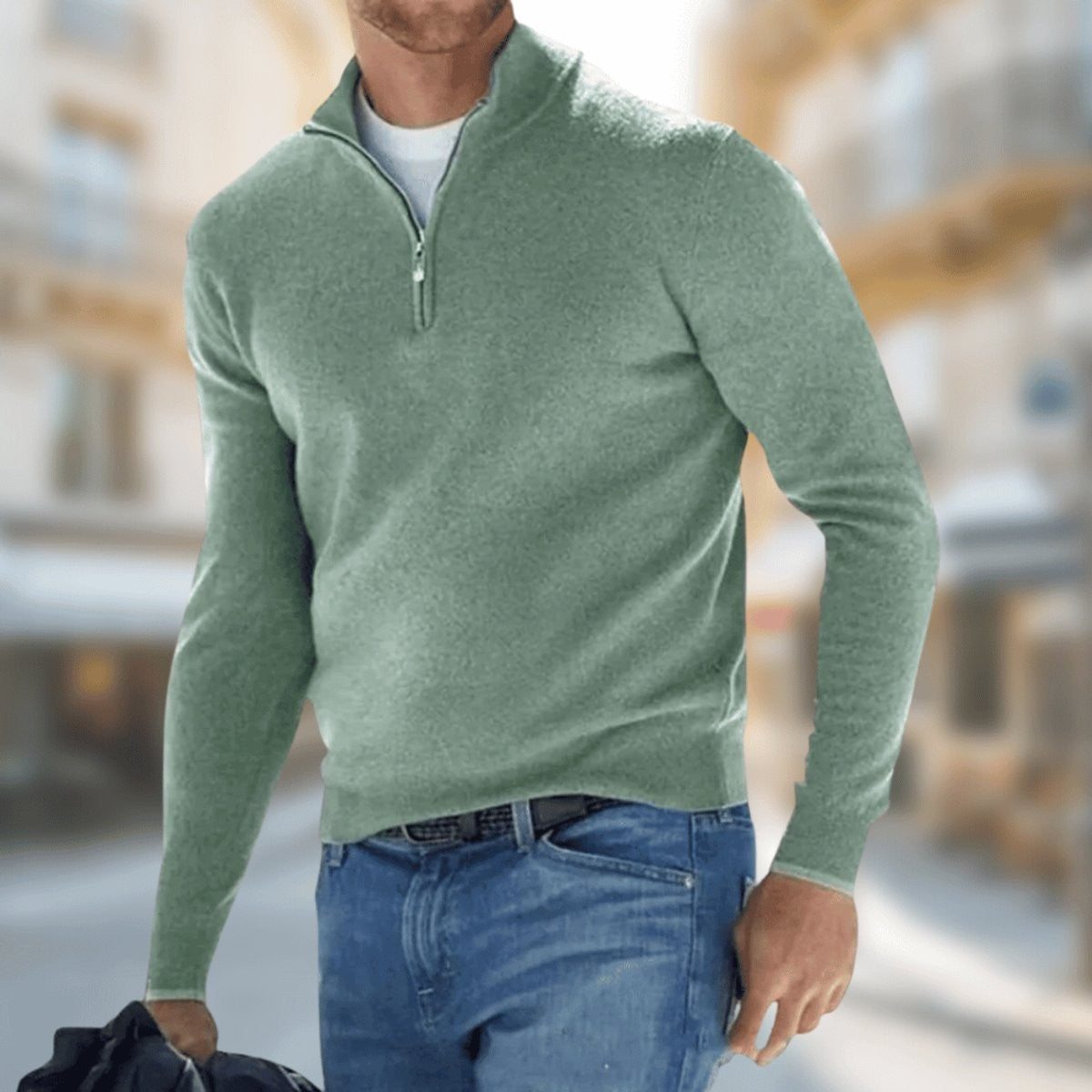 Sage green fine-knit quarter-zip pullover styled with classic denim jeans