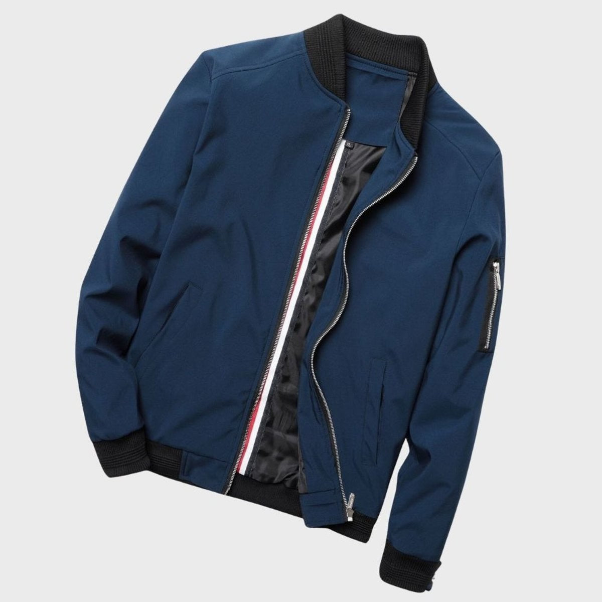Navy zip-up bomber jacket showing contrast striped inner placket