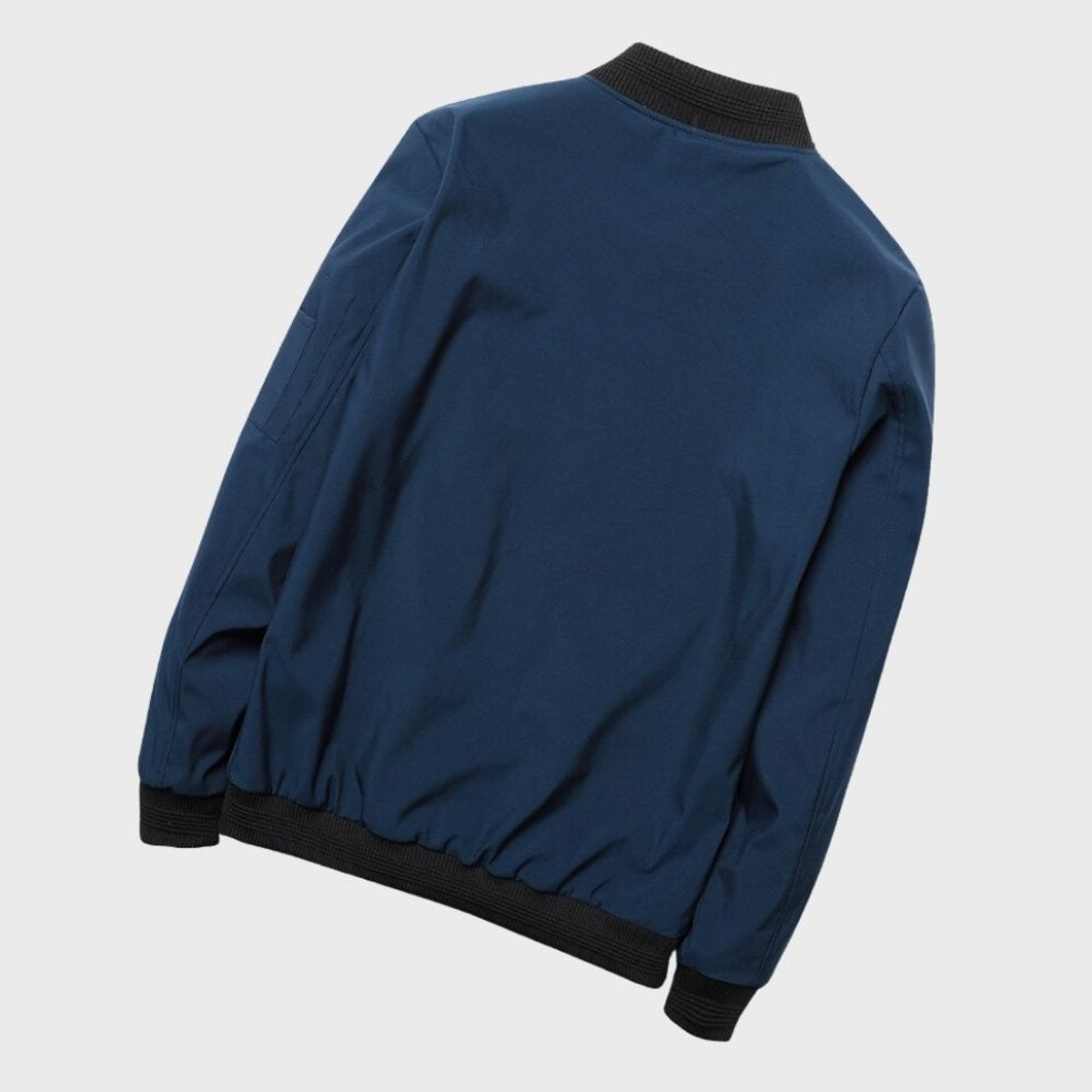 Navy bomber jacket rear view showing ribbed hem and cuffs