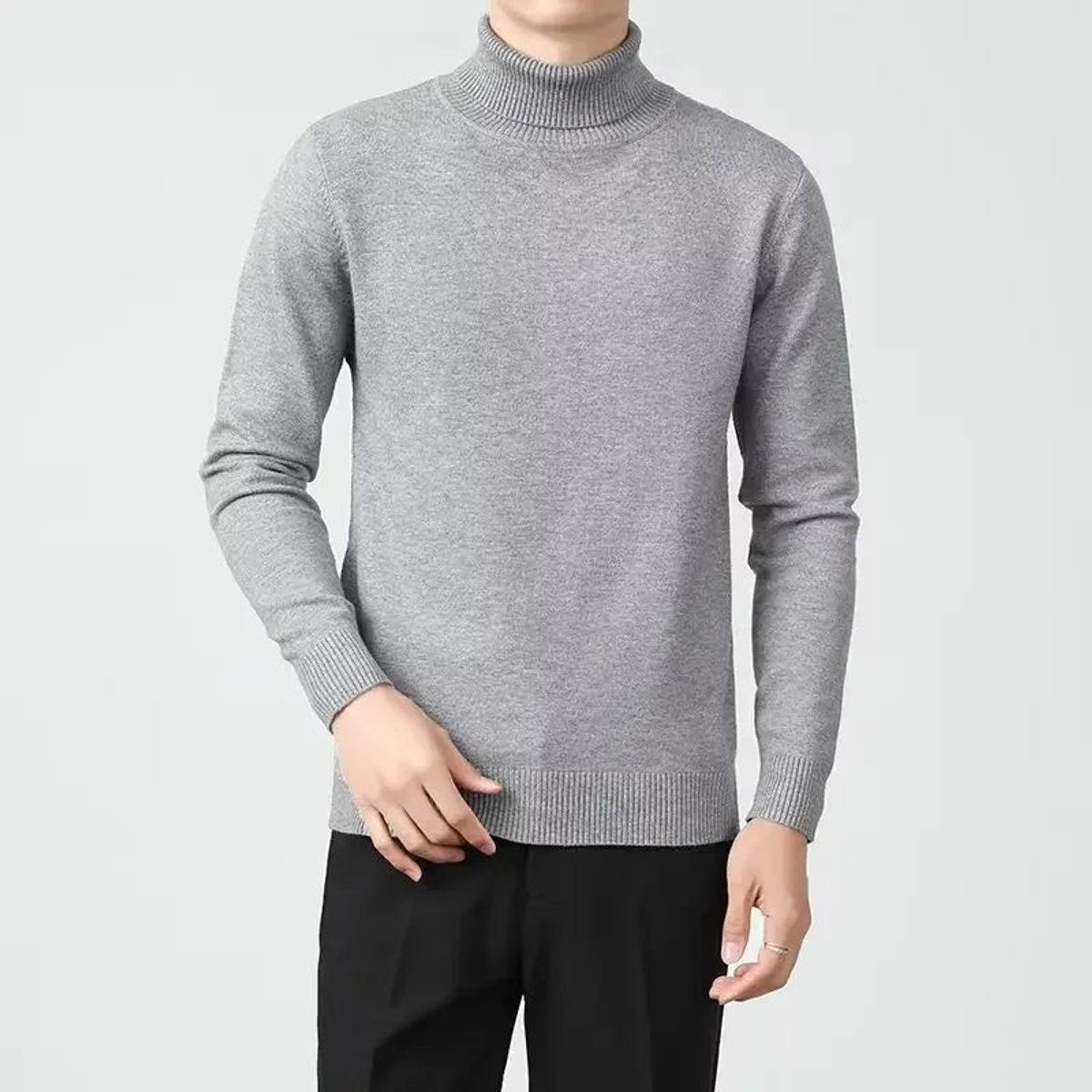 Light grey roll-neck jumper in slim-fit cashmere knit, paired with black trousers