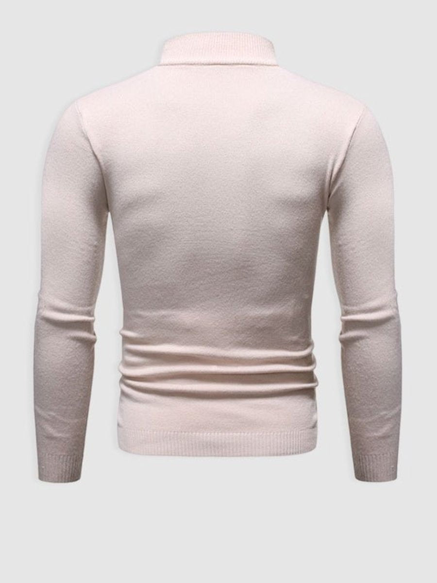 Cream knitted turtleneck jumper shown from behind with ribbed hem detail
