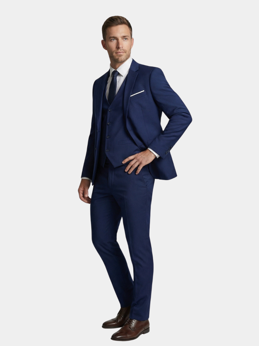 Navy blue three-piece wool blend suit styled with tie and brown brogues