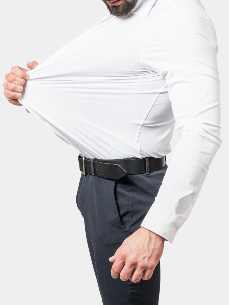 Model stretching white slim-fit shirt fabric to show four-way stretch