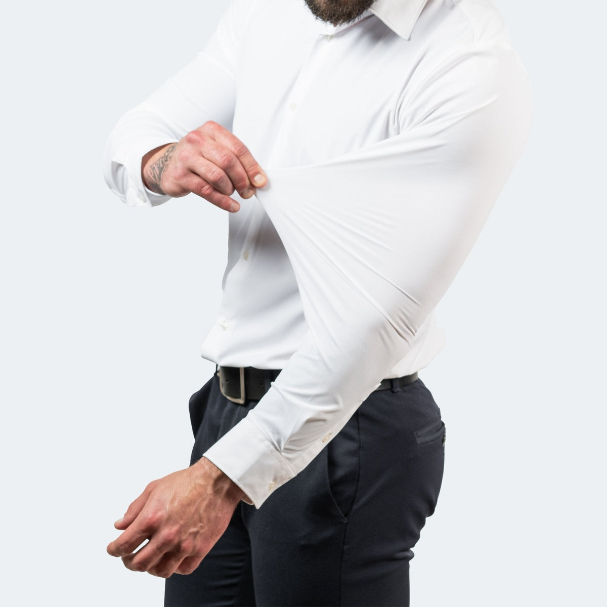 White stretch dress shirt sleeve pulled to demonstrate flexible fabric
