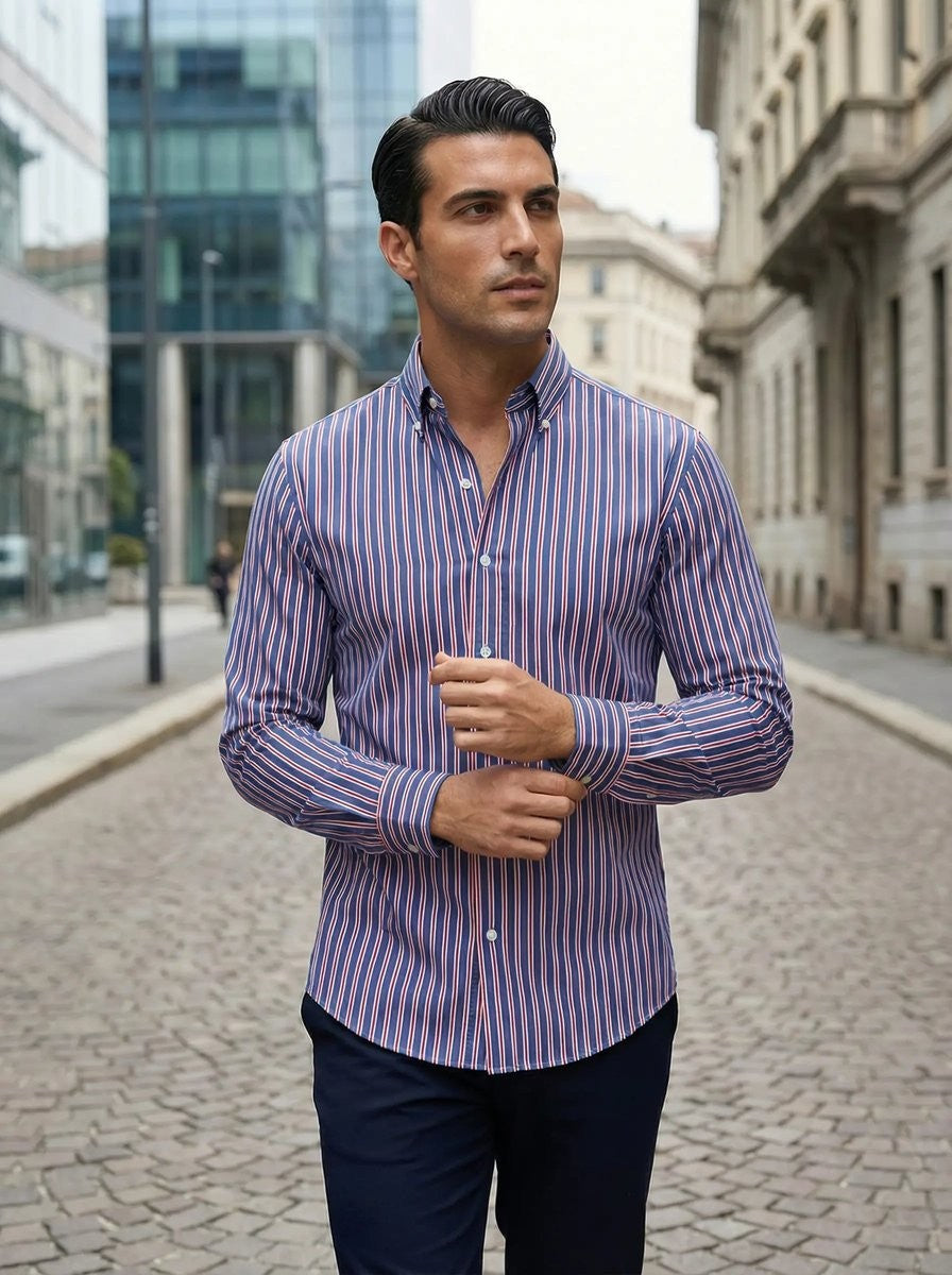Man styling navy and red striped shirt with navy chinos in the city