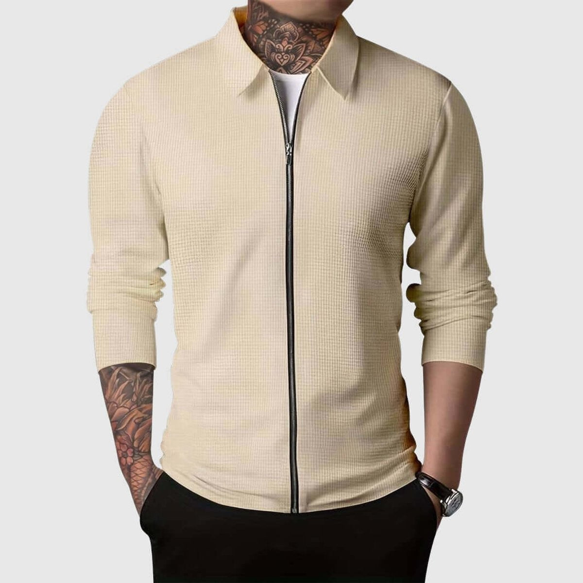Beige waffle-knit zip-up shirt jacket with collar, worn with black trousers