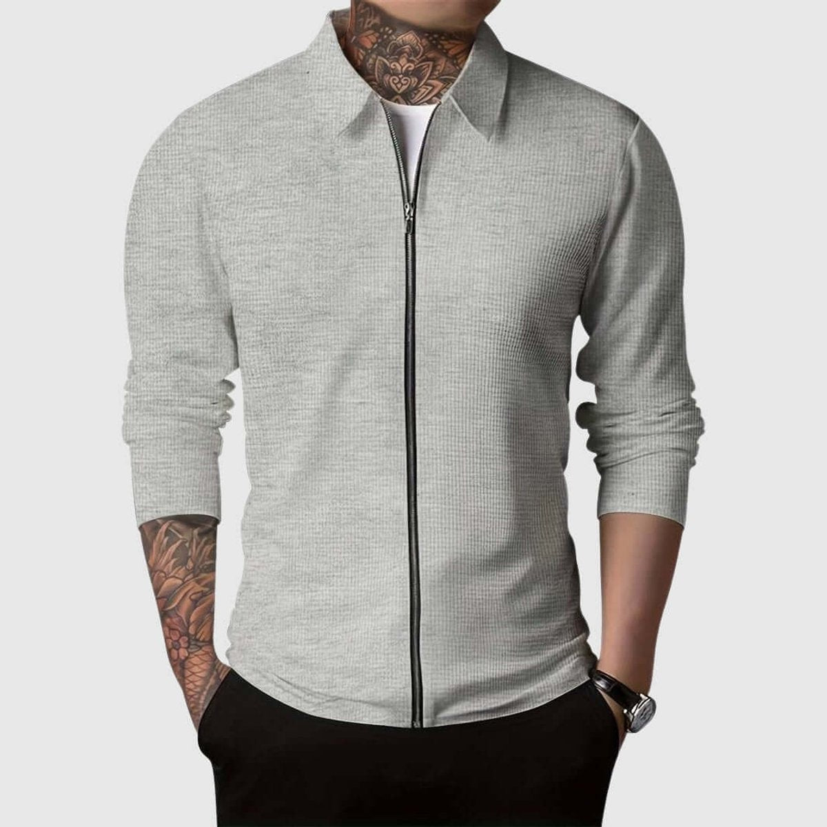 Grey waffle-knit full-zip jacket with collar, paired with black trousers