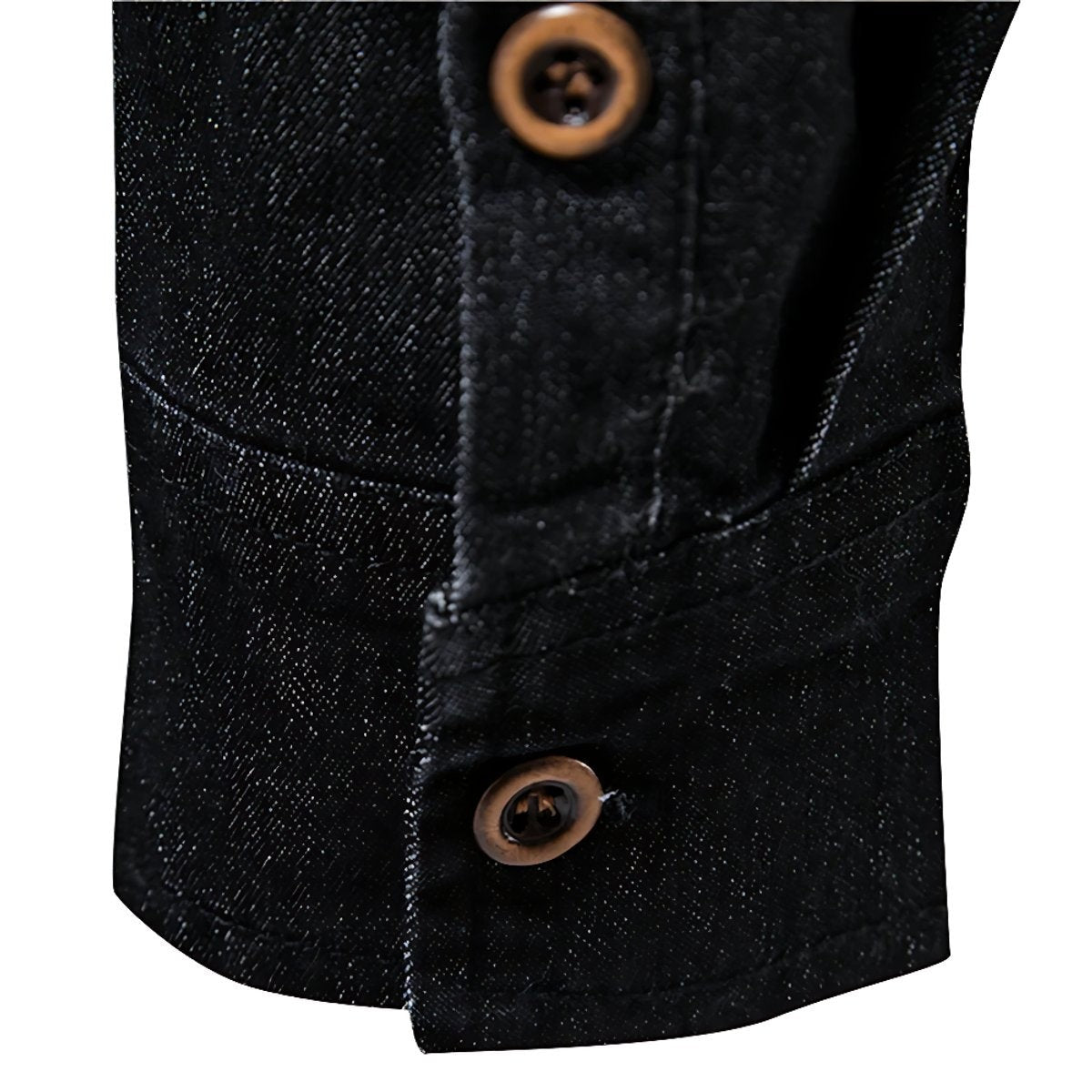Macro shot of black denim shirt cuff button and textured woven fabric