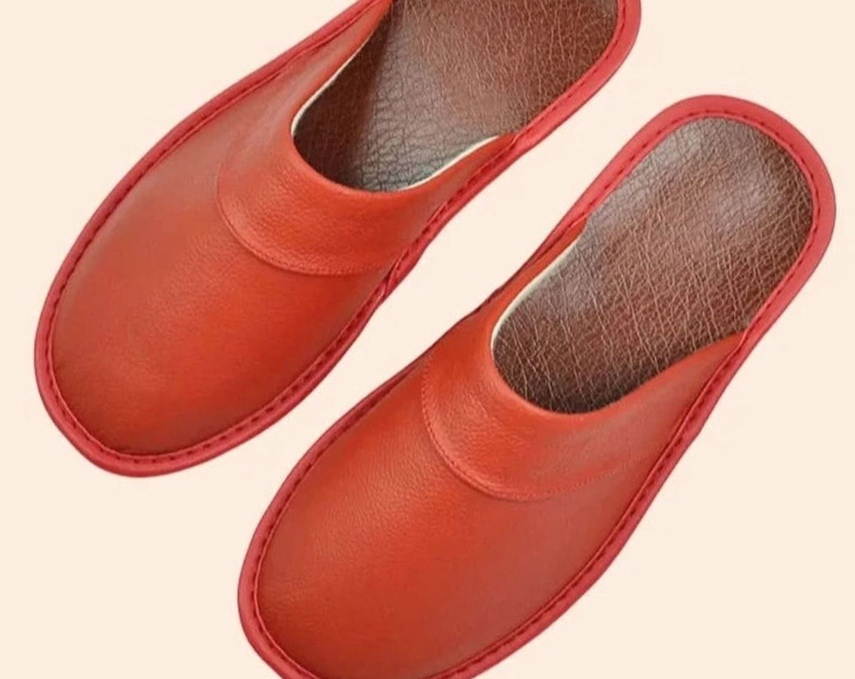 Orange leather slip-on slippers with tan leather insole
