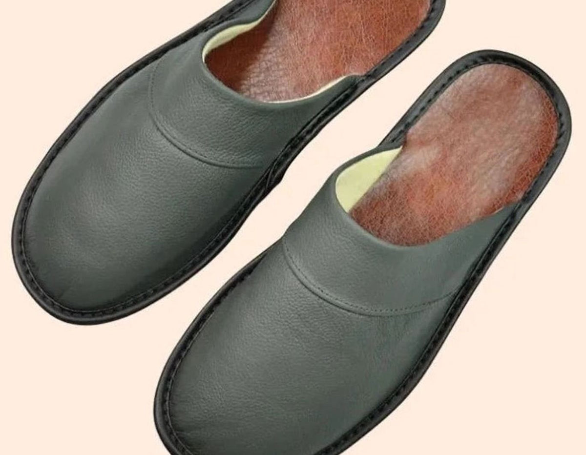 Sage green leather mules with black stitched edging