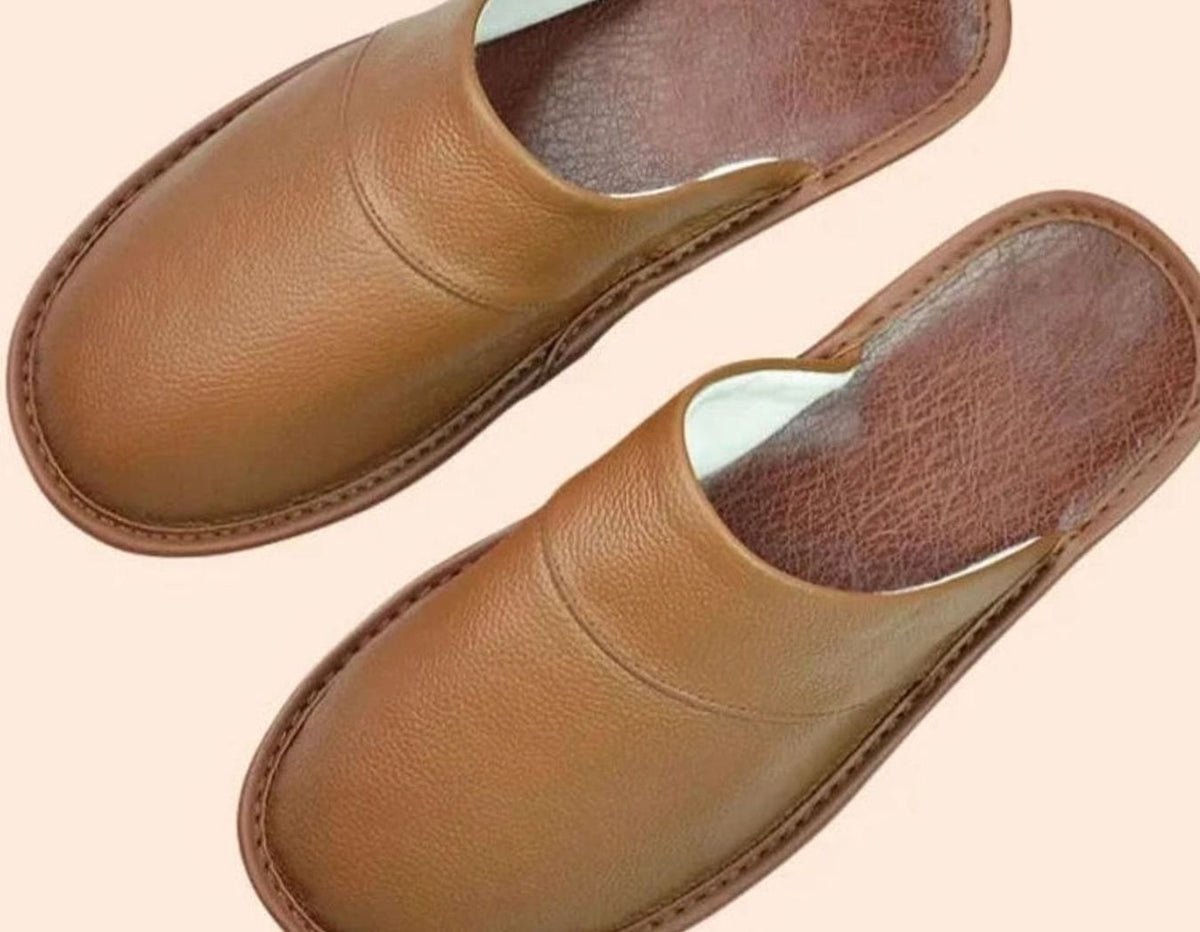 Tan brown leather closed-toe mules with stitched detailing