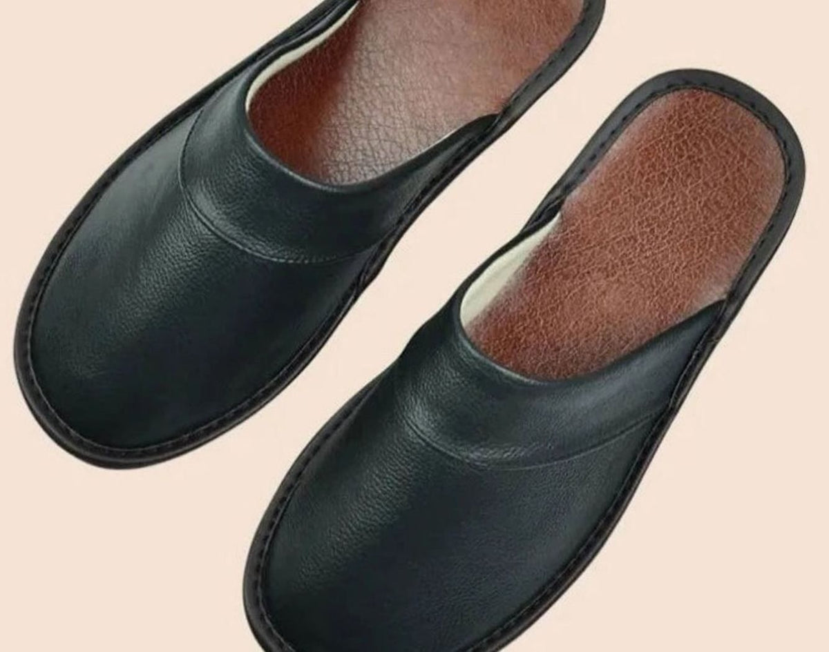 Matte black leather mules with rounded closed toe design