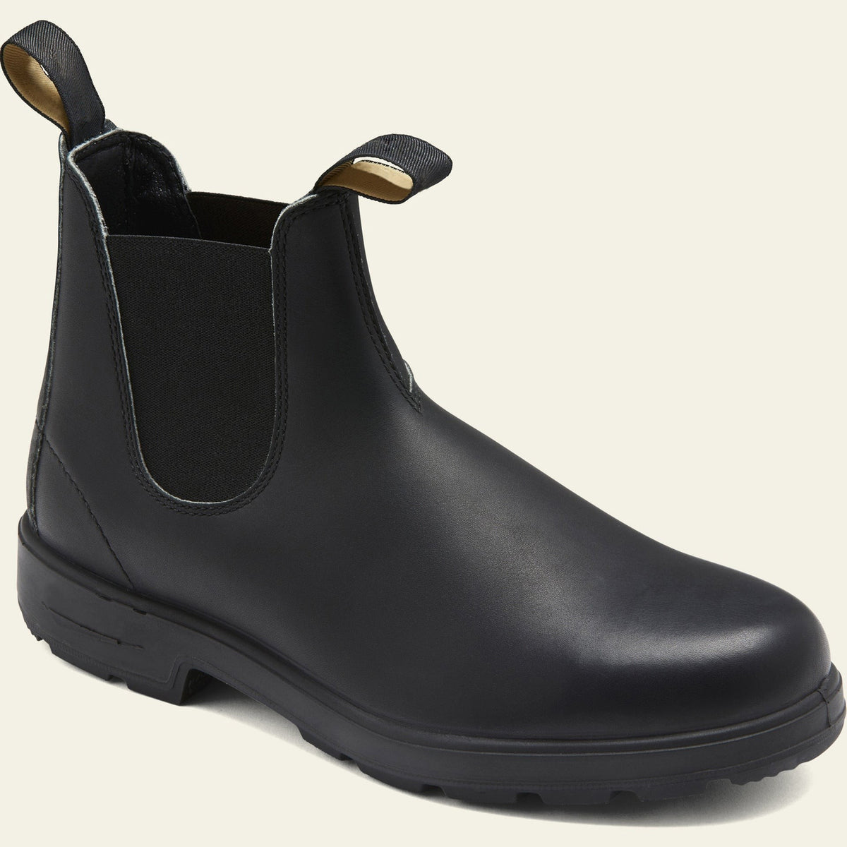 Black leather slip-on Chelsea boot featuring gold-toned pull loops