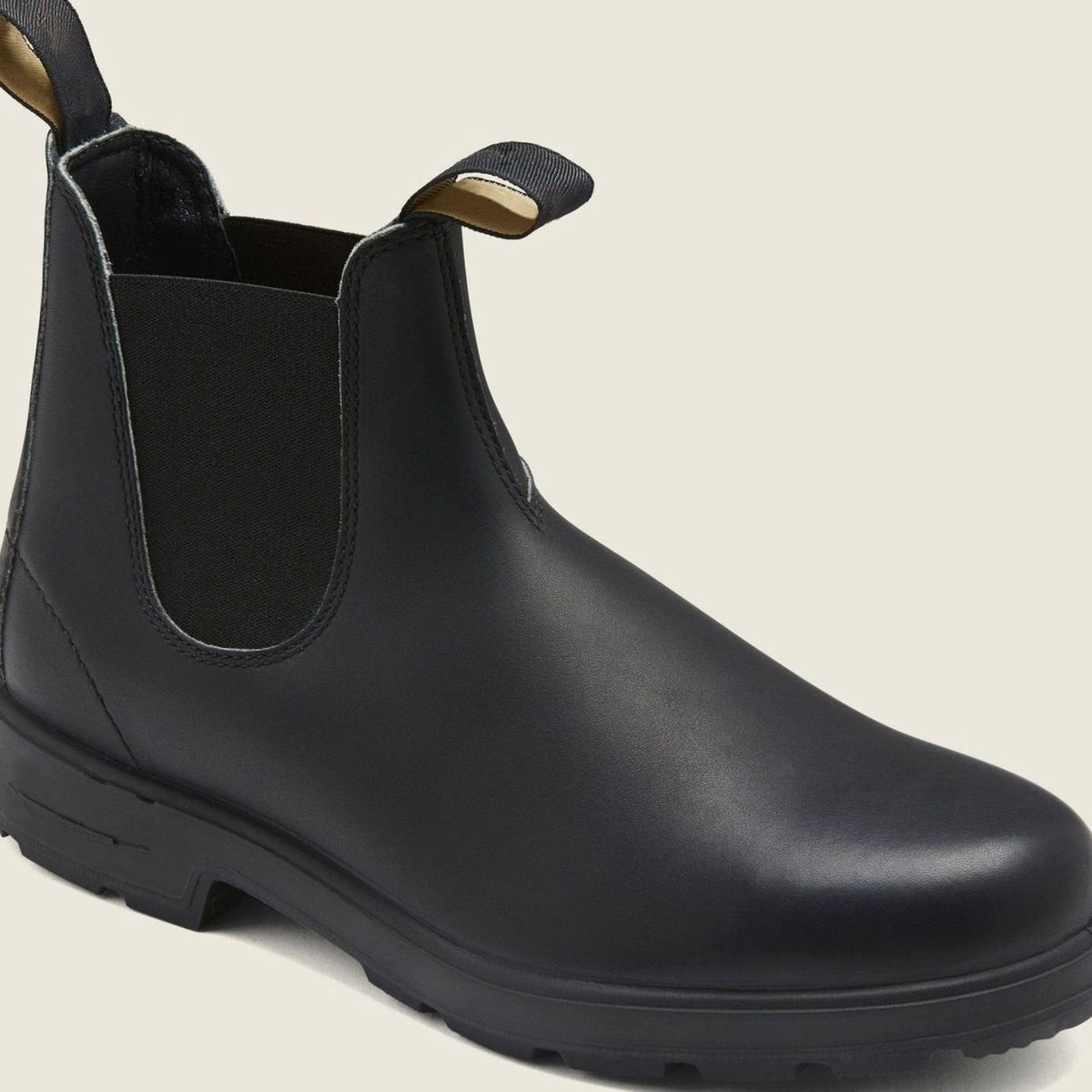 Black leather Chelsea boot with elastic side panel and rugged tread
