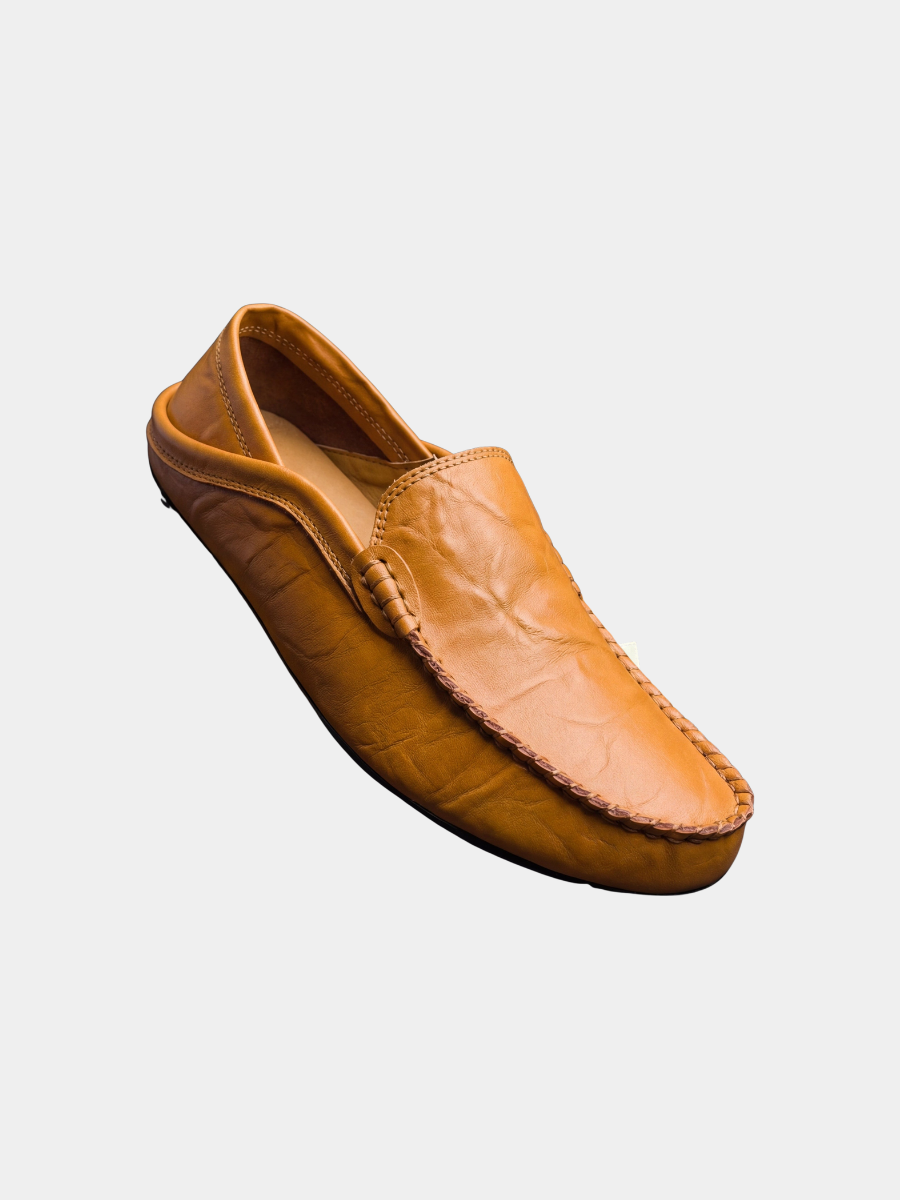 Tan leather slip-on loafer with stitched moc-toe and knot buckle detail
