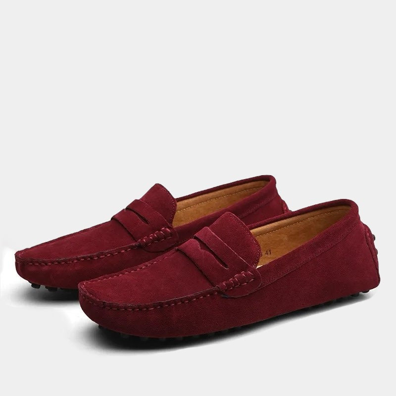 Wine red suede moccasin loafers featuring classic penny strap detail