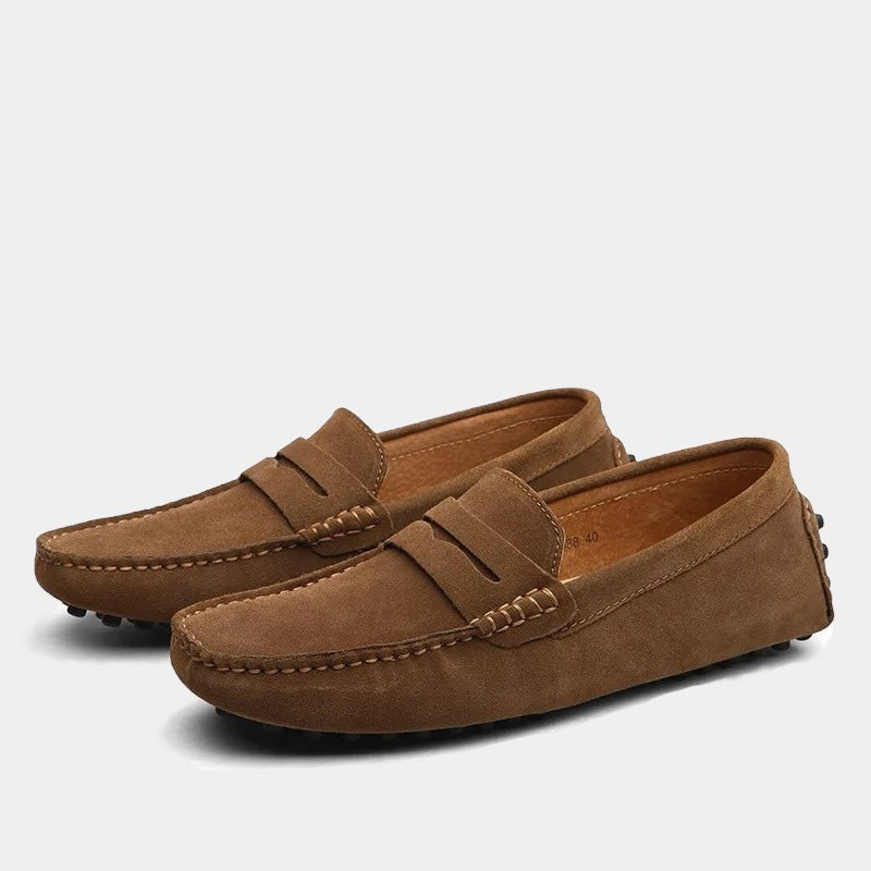 Tan suede driving loafers with rubber pebble sole and stitched trim
