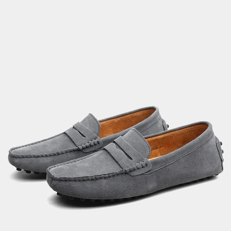 Charcoal grey suede driving loafers with classic penny strap styling