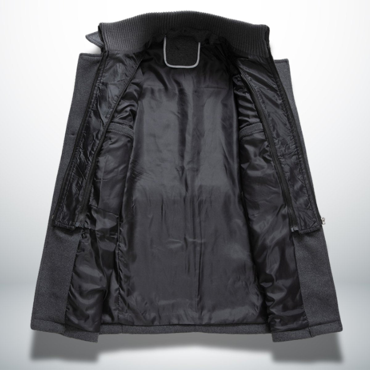 Interior view of grey overcoat revealing black satin lining and zip pockets