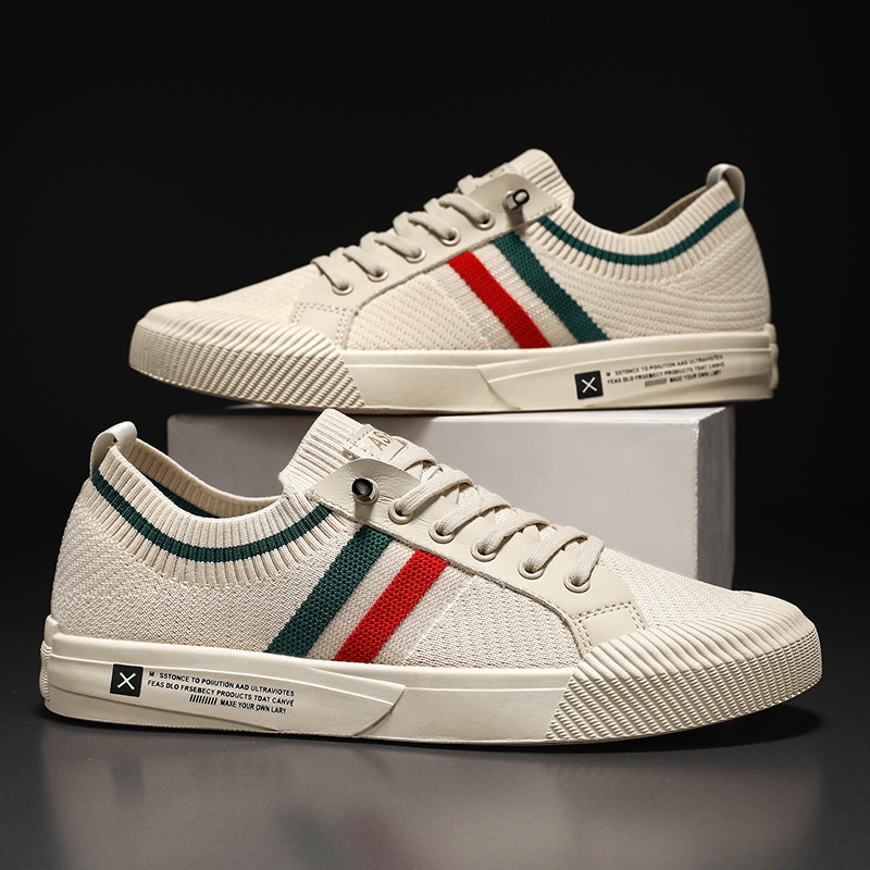 Pair of beige mesh trainers with ribbed sole and stripe trim