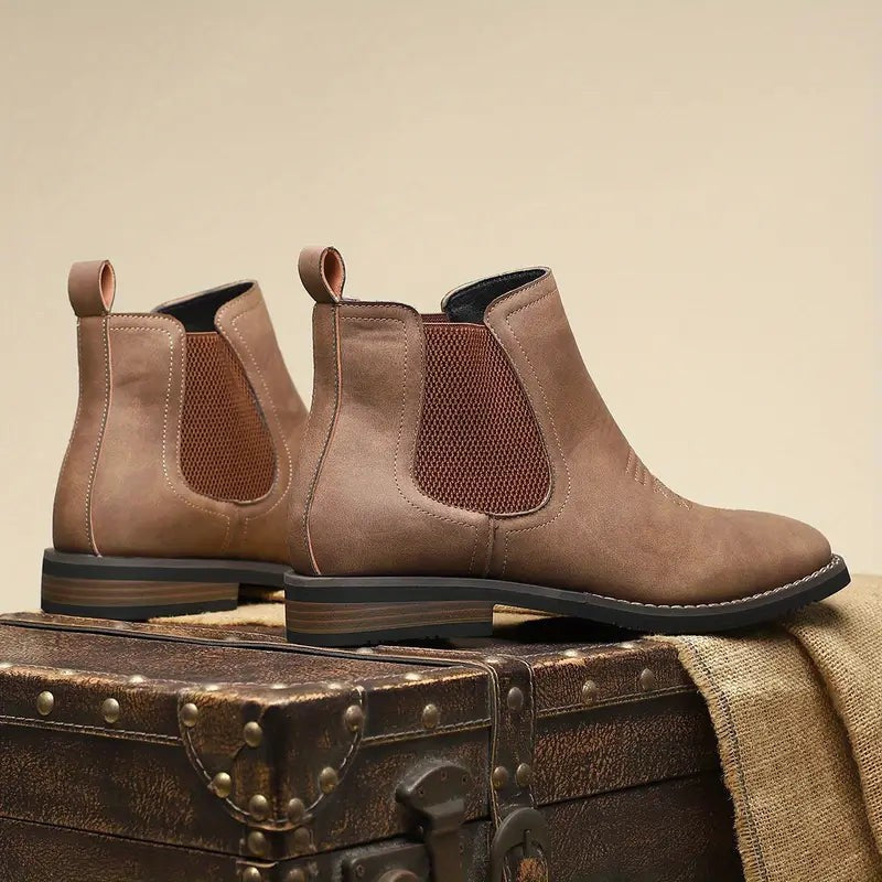 Taupe leather Chelsea boots with rust-toned elastic side panels