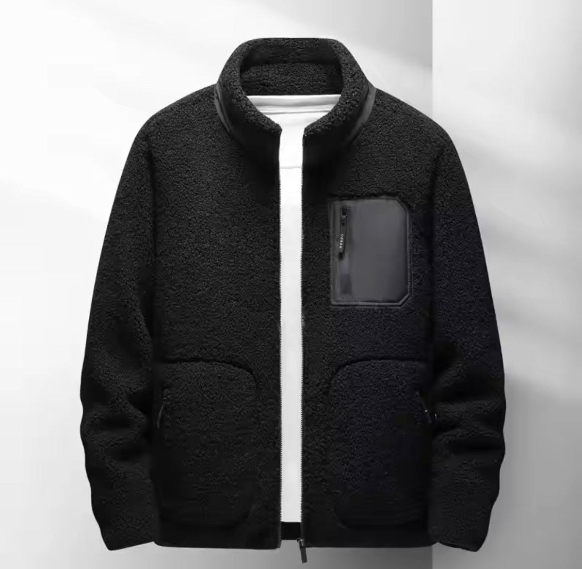 Black sherpa fleece bomber jacket featuring zipped chest pocket and stand collar