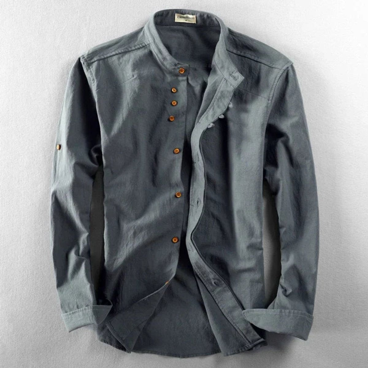 Grey stand-collar linen shirt with long sleeves and wooden button detail