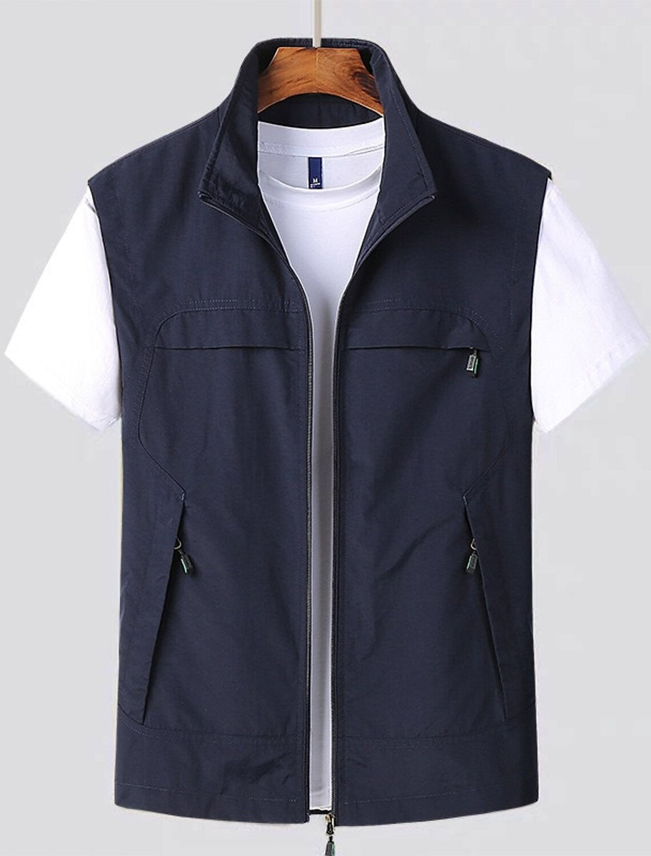 Navy zip-up utility gilet with stand collar and multiple pockets, worn on hanger