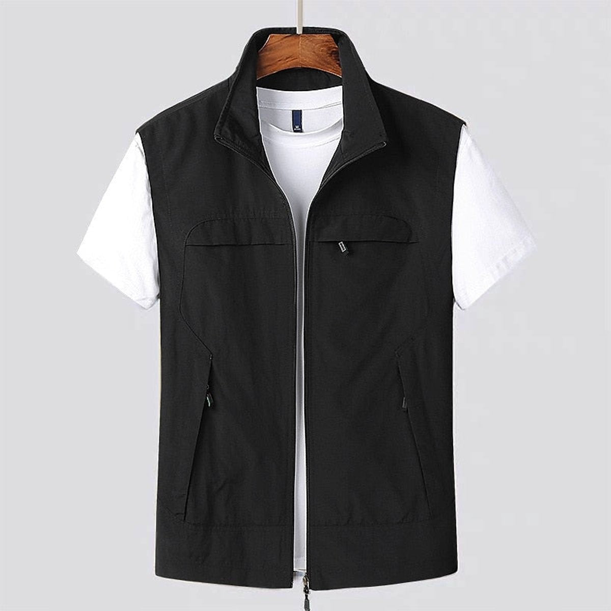 Black sleeveless zip gilet with stand collar and chest pocket detailing