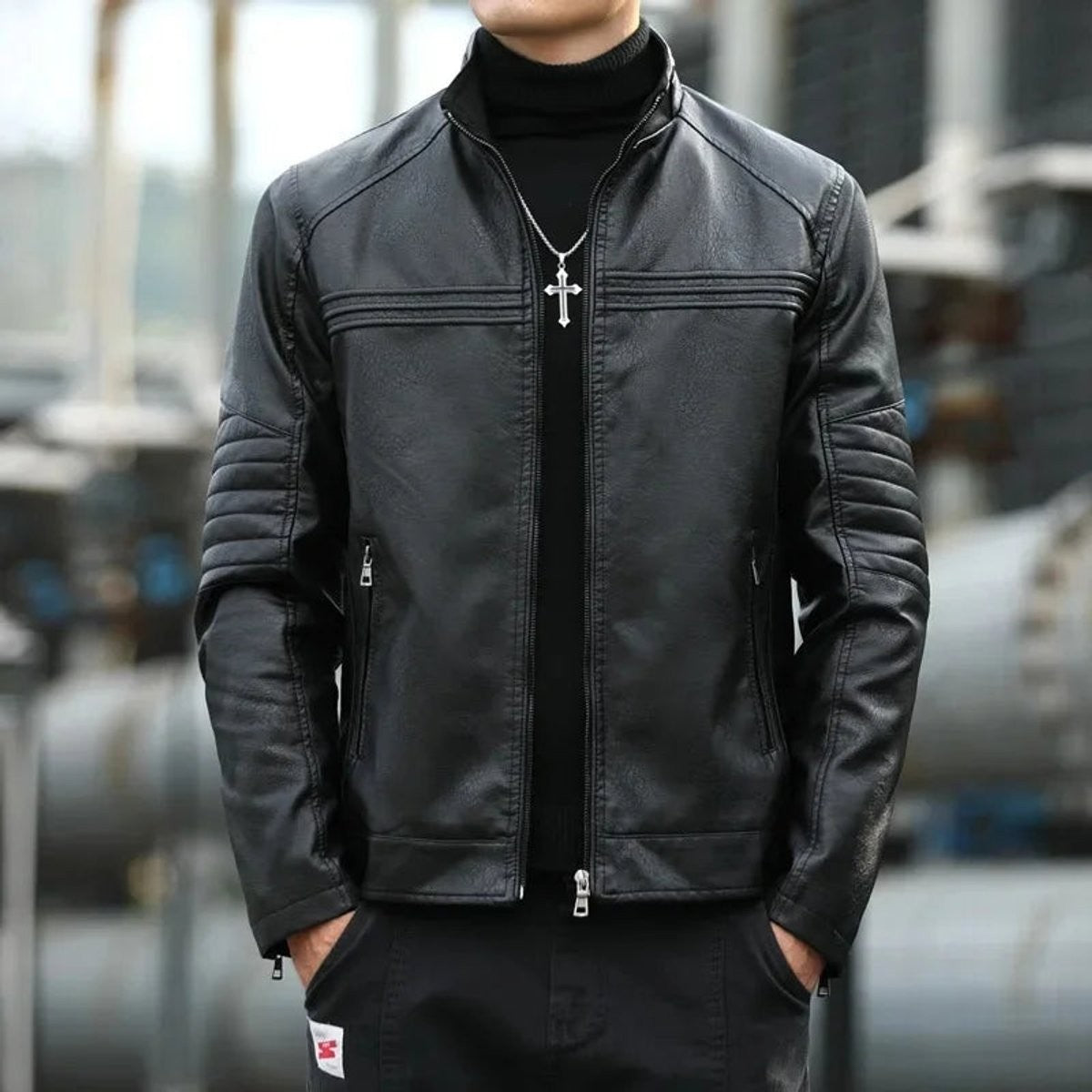 Black faux leather biker jacket with stand collar and quilted sleeve panels