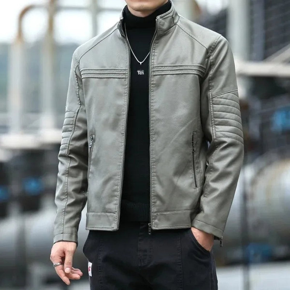 Grey biker-style leather jacket with stand collar and quilted sleeve accents