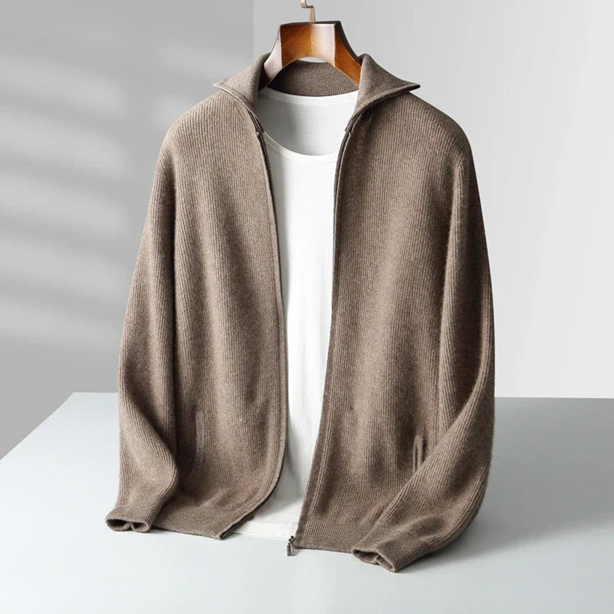 Taupe cashmere zip cardigan draped open over white t-shirt