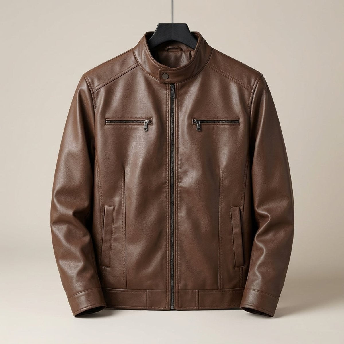 Brown leather biker jacket with stand collar and zip pockets on hanger