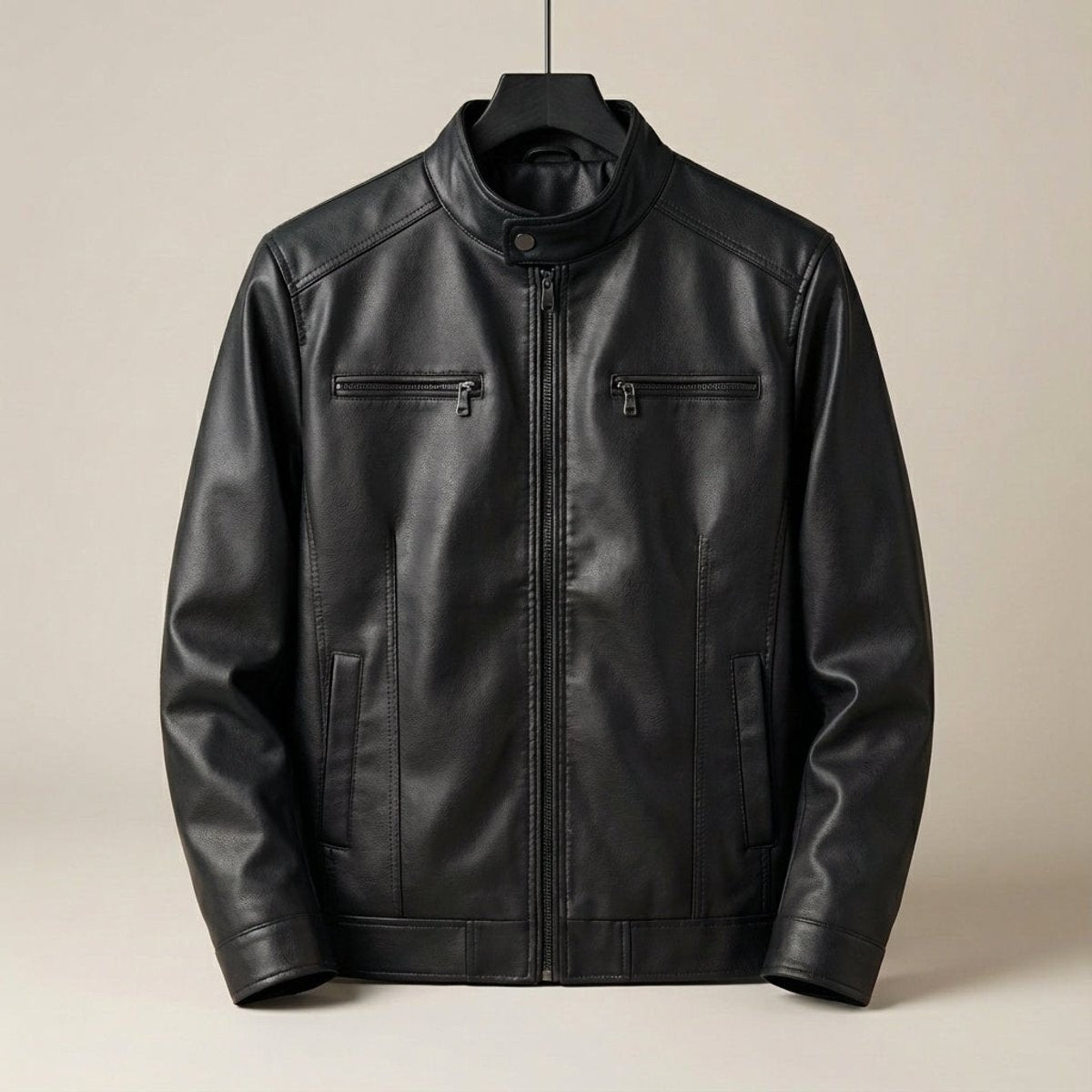 Black cowhide-style leather biker jacket with stand collar displayed on hanger