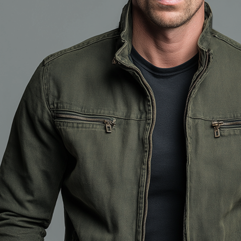 Close-up of olive cotton jacket showing stand collar and chest zip detailing