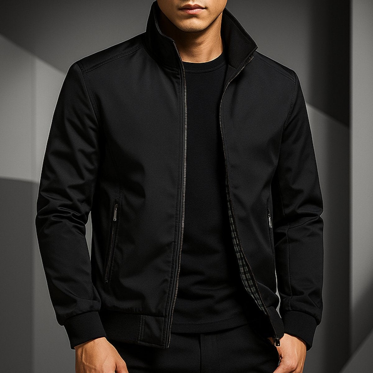 Model in black zip-up bomber jacket styled with plain black t-shirt