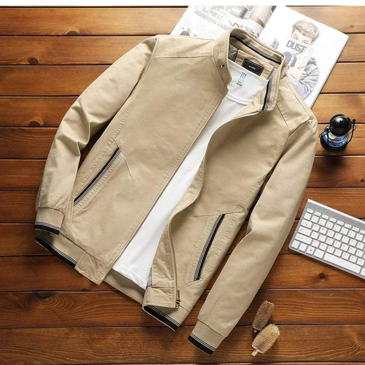 Light beige bomber jacket featuring striped ribbed hem and cuffs