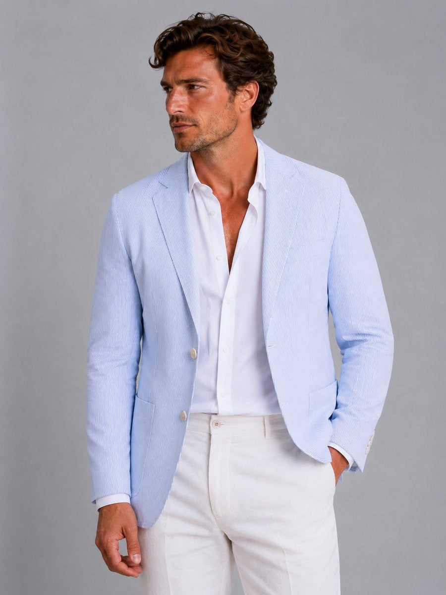 Close-up of light blue seersucker tailored blazer with notch lapel detail