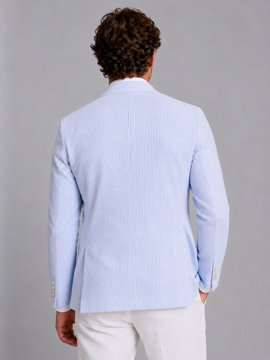 Rear view of light blue striped seersucker blazer showing tailored fit